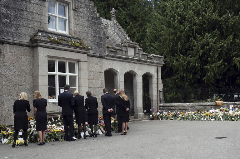 Members of the Royal family From left, Britain's Prince Edward, Lady Louise Windsor and Sophie Countess of Wessex view floral tributes for Queen Elizabeth II outside the gates of Balmoral Castle in Aberdeenshire, Scotland Saturday, Sept. 10, 2022. Queen Elizabeth II, Britain's longest-reigning monarch and a rock of stability across much of a turbulent century, died Thursday after 70 years on the throne. She was 96. (AP Photo/Scott Heppell)