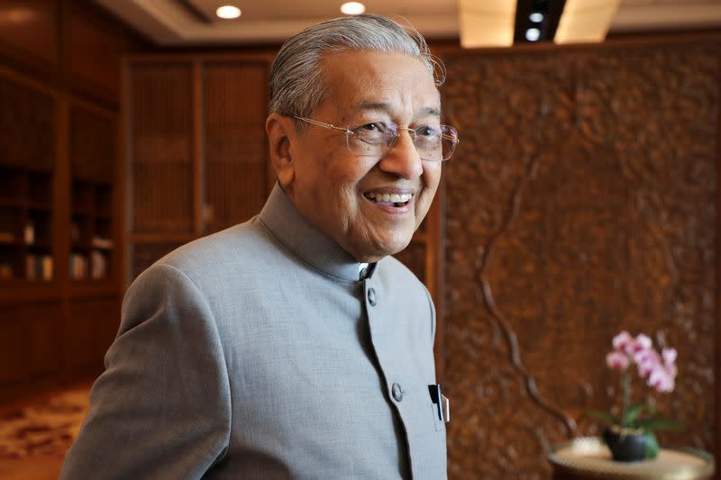 Malaysia's Prime Minister Mahathir Mohamad reacts during an interview with Reuters in Putrajaya