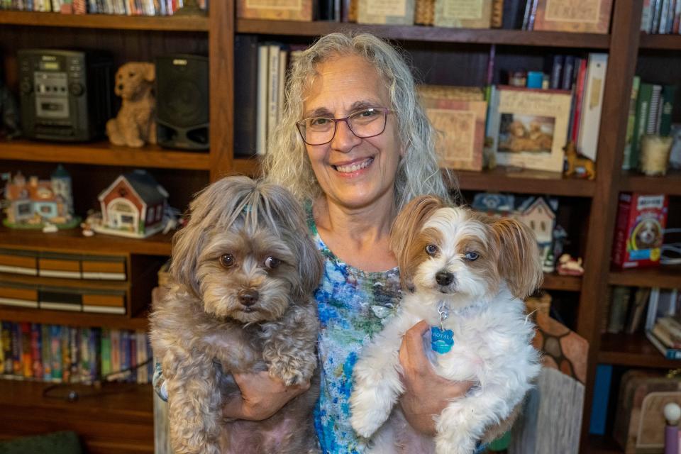 Sharon Dodsworth holds her two "pupstar": Mocha, left, and Royal.