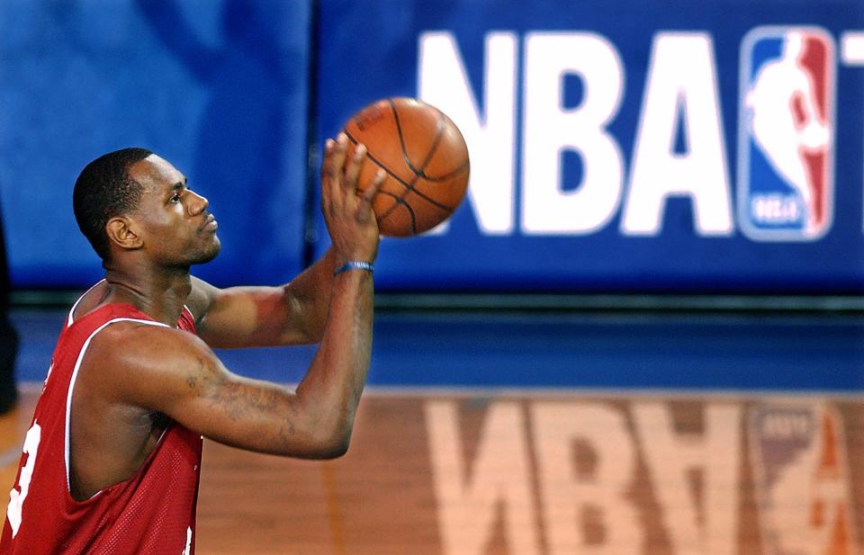 As a Cavaliers rookie, LeBron James takes a foul shot during a summer league game against Atlanta on July 18, 2003, in Boston.