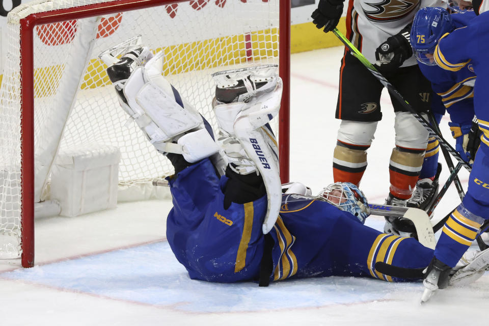 Buffalo Sabres goaltender Ukko-Pekka Luukkonen (1) covers the puck during the third period of an NHL hockey game against the Anaheim Ducks Monday, Feb. 19, 2024, in Buffalo, N.Y. (AP Photo/Jeffrey T. Barnes)