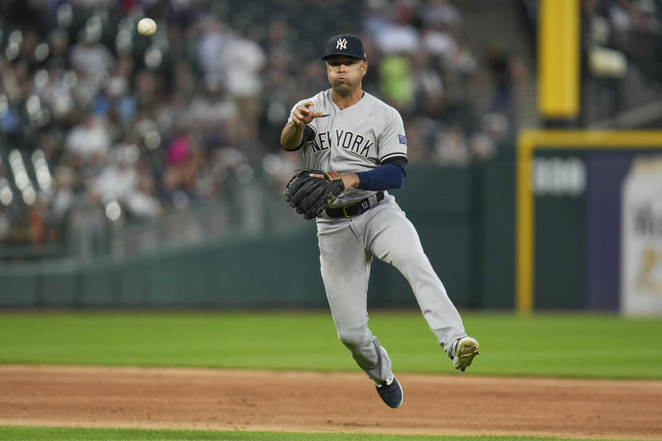 New York Yankees third baseman Isiah Kiner-Falefa throws to first for the out on Chicago White Sox's Andrew Benintendi during the third inning of a baseball game Tuesday, Aug. 8, 2023, in Chicago. (AP Photo Erin Hooley)