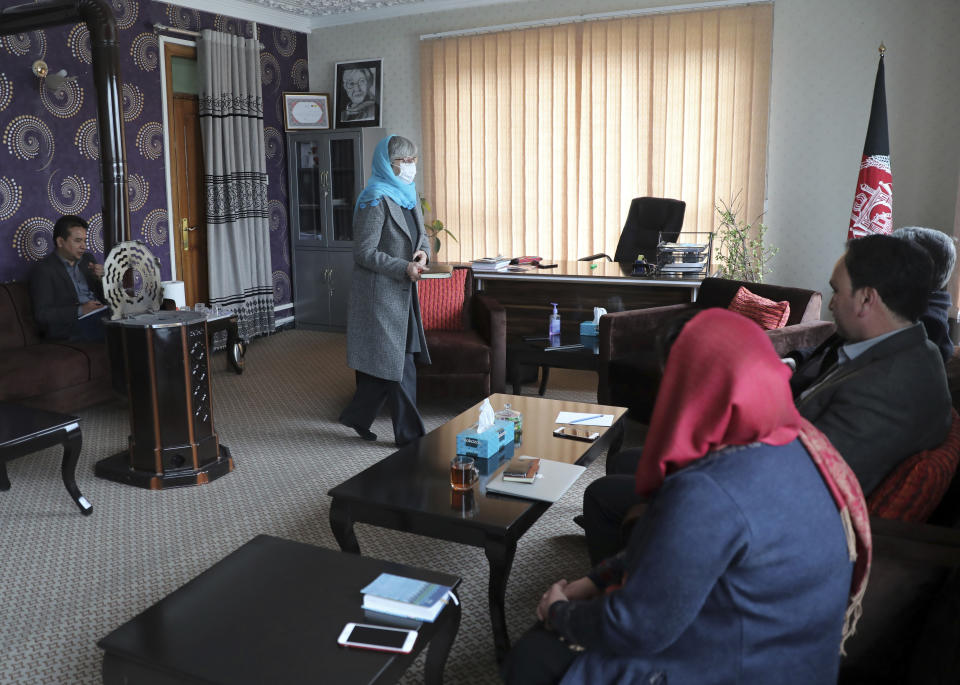 Sima Samar, center, a prominent activist and physician, who has been fighting for women’s rights in Afghanistan for the past 40 years, arrives for a meeting with colleagues at her office in Kabul, Afghanistan, Saturday, March 6, 2021. Samar believes her struggle is far from over -- especially at a time when violence is on the rise, peace talks between rival Afghan groups are stuck and the U.S. mulls its departure. (AP Photo/Rahmat Gul)