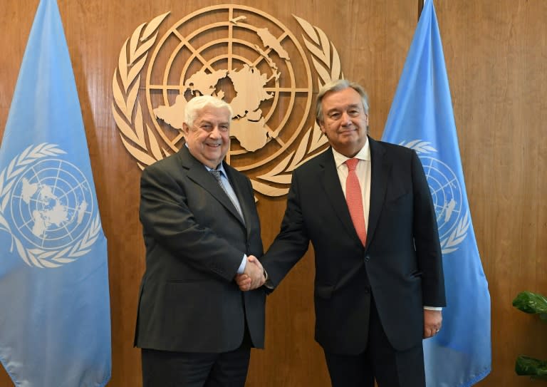 Syria's Foreign Minister Walid al-Muallem (L) meets UN Secretary General Antonio Guterres at the United Nations in New York on September 21, 2017
