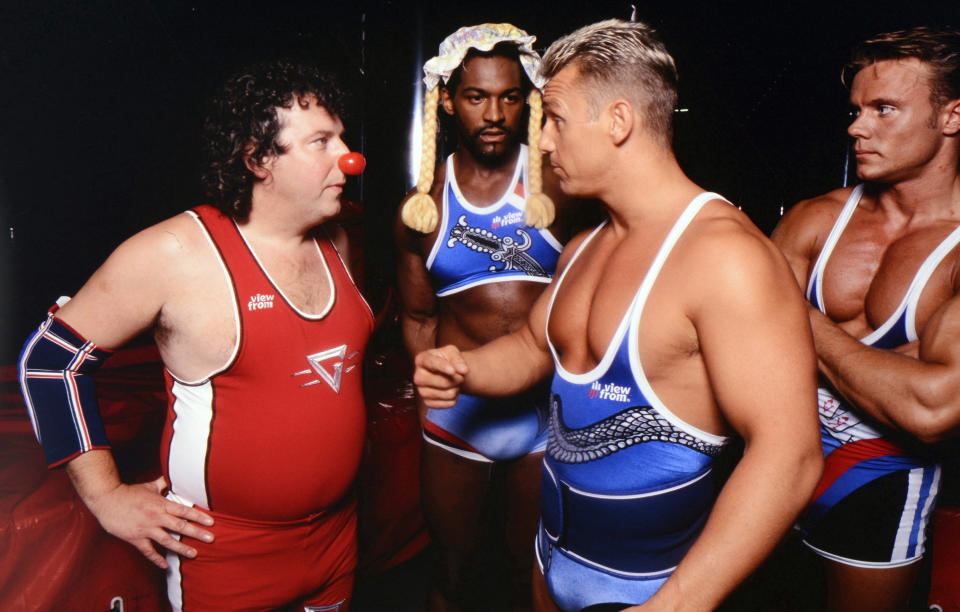 Paul Bradley (L) with Saracen (Michael Lewis), Cobra (Michael Willson) and Ace (Warren Furman) during Gladiators. (Getty)