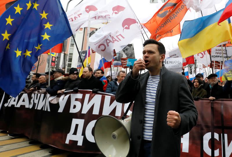 Russian opposition figure Ilya Yashin takes part in a rally to mark the 5th anniversary of opposition politician Boris Nemtsov's murder and to protest against proposed amendments to the country's constitution, in Moscow