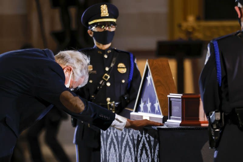 Visitors pay respects before a ceremony memorializing U.S. Capitol Police Officer Brian D. Sicknick, 42, as he lies in honor in the Rotunda of the Capitol on February 3, 2021. Sicknick was fatally injured in the riot at the U.S. Capitol on January 6, 2021. File Photo by Carlos Barria/UPI