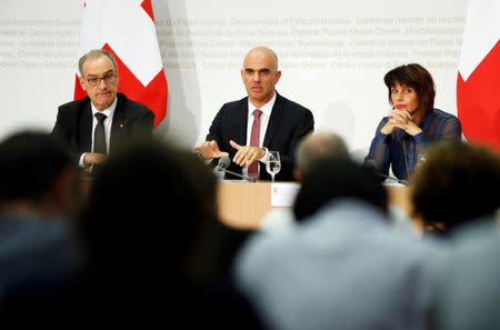 Swiss Defence Minister Guy Parmelin (L-R), Interior Minister Alain Berset and Energy Minister Doris Leuthard attend a news conference in Bern September 25, 2016. REUTERS/Ruben Sprich