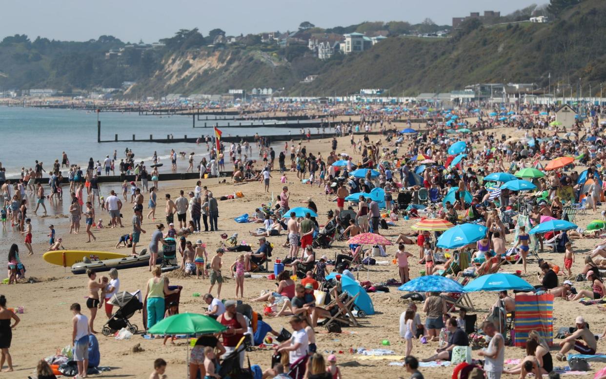 People enjoy the hot weather at Bournemouth beach, Dorset - PA