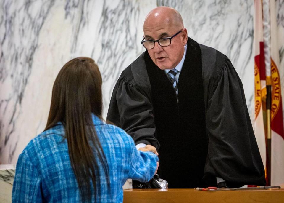 Ronit Felszer thanks Judge Michael Hanzman and shakes his hand after the proceedings. In a surprise development, the class-action litigation over the collapse of Champlain Towers South has been settled, a federal judge was told Wednesday, with plaintiffs expected to receive just under $1 billion.