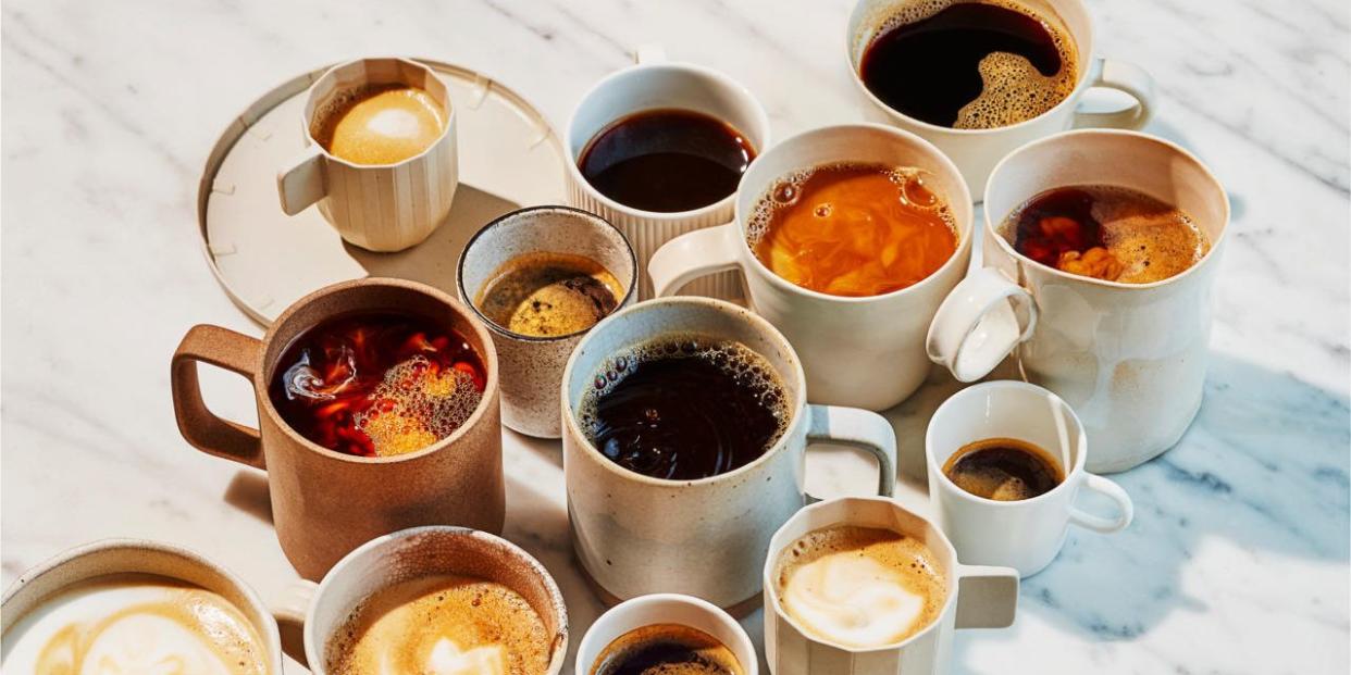 a group of coffee cups with liquid in them