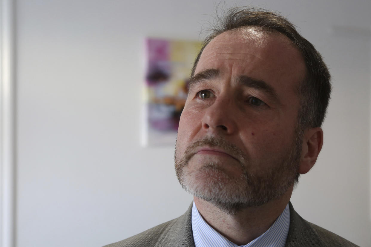 Christopher Pincher, UK minister for Europe is seen at a care home during his visit the British NGOs and volunteer groups in southern city of Larnaca, Cyprus, Friday, Oct. 4, 2019. British NGOs and volunteer groups are helping some of the approximately 70,000 British expatriates in Cyprus to sort out their residency status once Britain leaves the European Union at the end of the month. (AP Photo/Petros Karadjias)