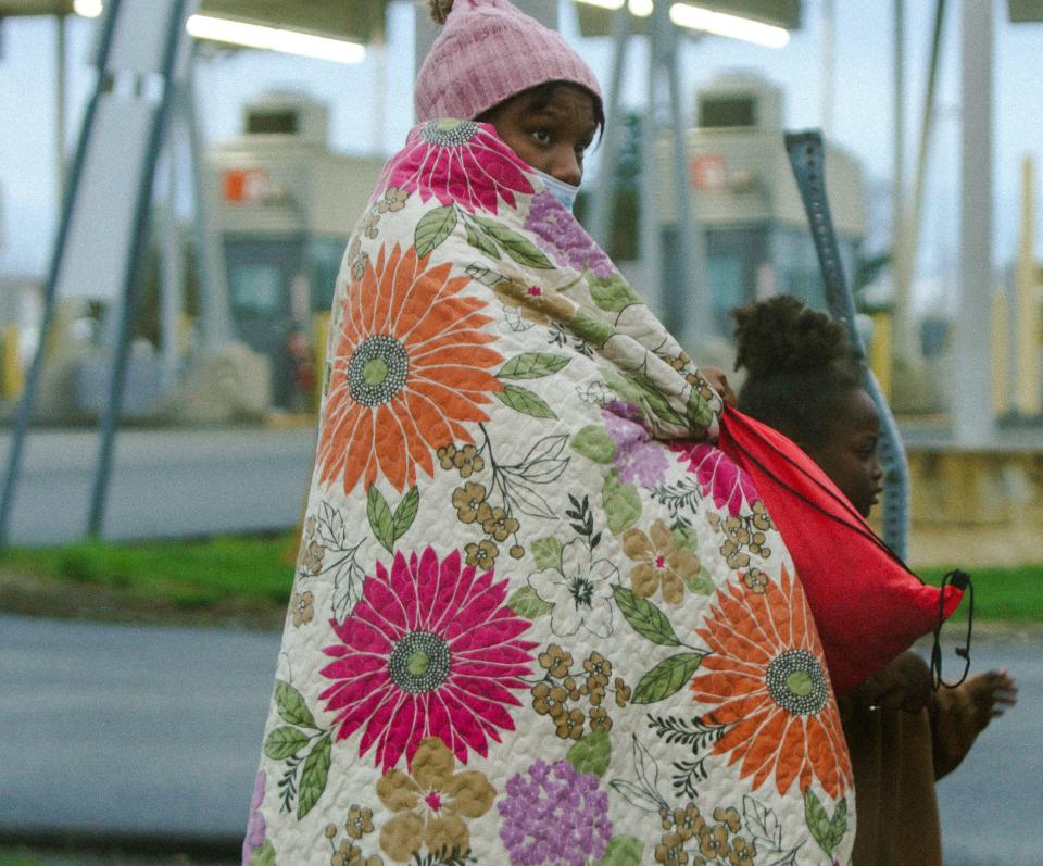 A woman and child prepare to present themselves at the U.S/Canadian border, 20 minutes from the Mountain Mart in Plattsburgh, NY.