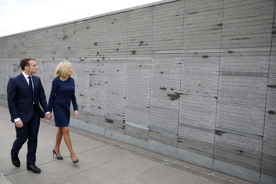 France’s President Emmanuel Macron and first lady Brigitte Macron visit the Remembrance Park, a monument on the banks of the Rio de la Plata in memory of the 30,000 people who disappeared or were killed under the 1976-1983 military regime, in Buenos Aires Thursday. (Photo: Ludovic Marin/AFP/Getty Images)