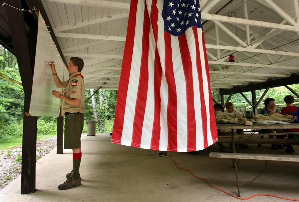 A Senior Patrol Leader prepares the lesson for his troop as they and other Boy Scouts are in the middle of National Youth Leadership Training at Camp Red Wing in this photo from 2008.