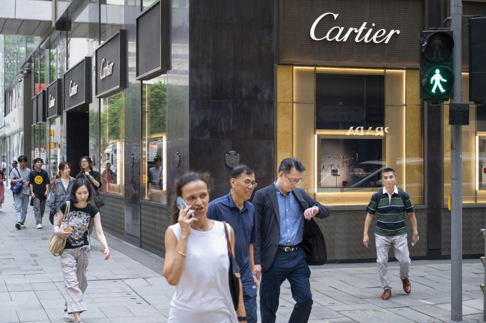 HONG KONG, CHINA - 2024/05/20: Pedestrians walk past the French luxury goods conglomerate Cartier store in Hong Kong. (Photo by Sebastian Ng/SOPA Images/LightRocket via Getty Images)