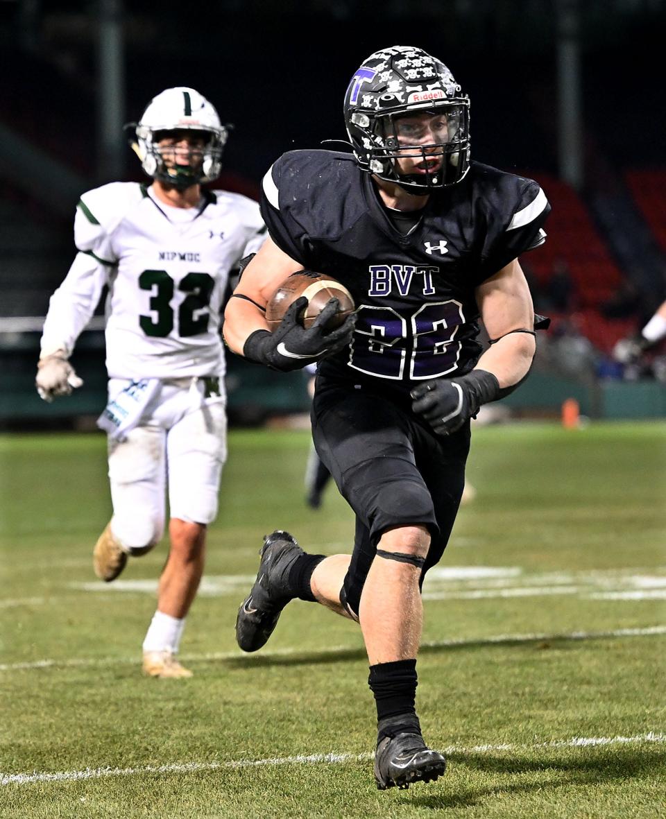 Blackstone Valley Tech's Trey Howe heads to the end zone for a touchdown during the first half against Nipmuc Regional at Fenway Park, Nov. 24, 2021.