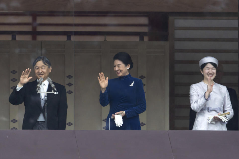 Japan's Emperor Naruhito, from left, Empress Masako and their daughter Princess Aiko wave to well-wishers from the balcony of the Imperial Palace in Tokyo on Friday, Feb. 23, 2024. Emperor Naruhito turns 64 on Friday. (Tomohiro Ohsumi/Pool Photo via AP)