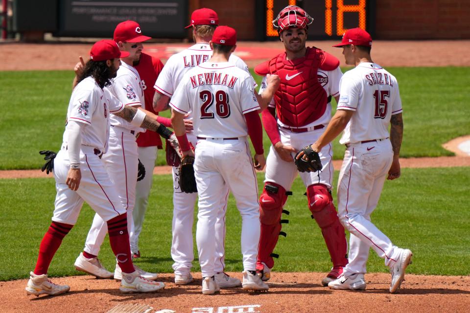 Cincinnati Reds manager David Bell (25) pulls Cincinnati Reds pitcher Ben Lively (59) out of the game in the fifth inning of a baseball game between the New York Mets and the Cincinnati Reds, Thursday, May 11, 2023, in Cincinnati.