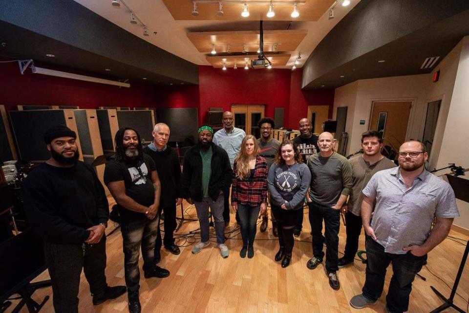 Performers gather during a rehearsal of "Nine Lives," a stage event featuring instrumental music, dance, spoken word and animation. "Nine Lives" will be presented on Feb. 7 at the University of Mount Union in Alliance.