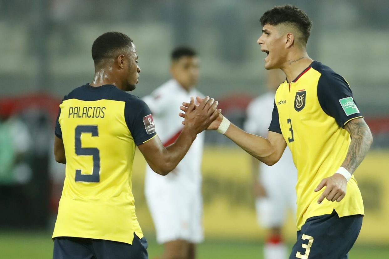 Diego Palacios, left, and Piero Hincapie shake hands during a World Cup qualifying match against Peru in February.