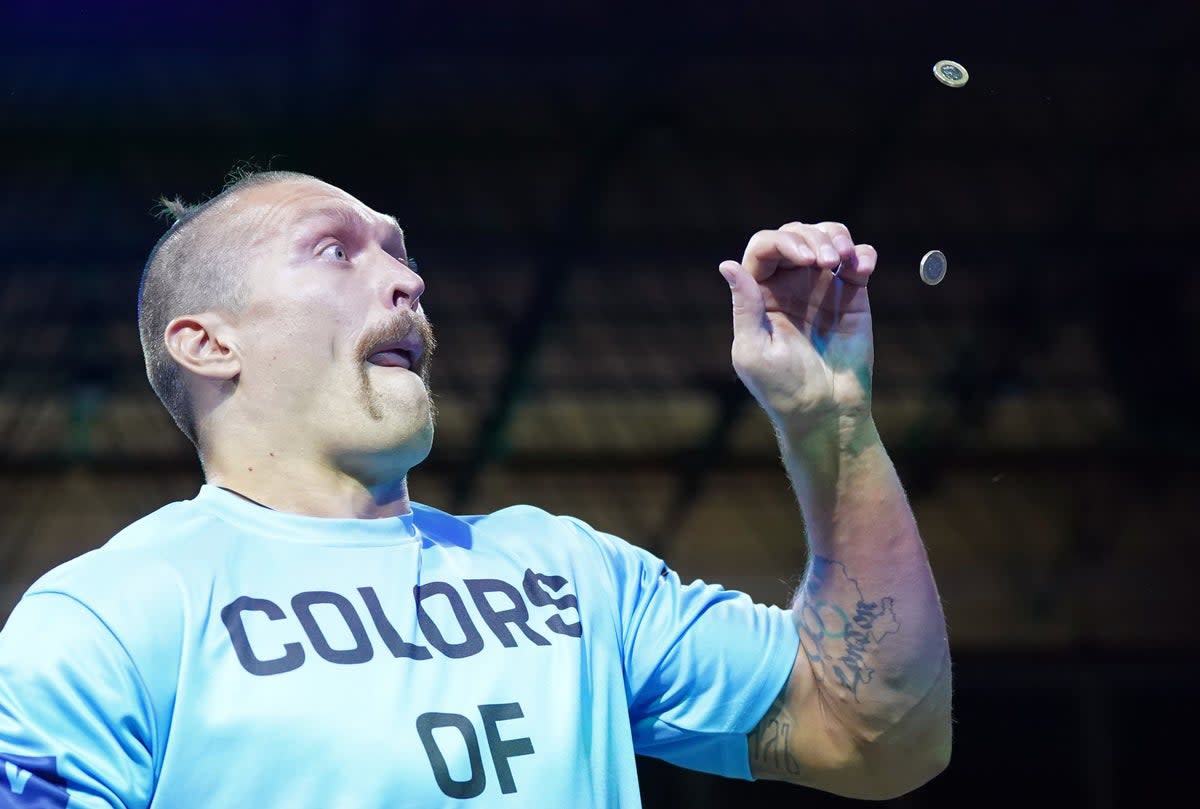 Oleksandr Usyk catching coins during a workout (Nick Potts/PA) (PA Wire)