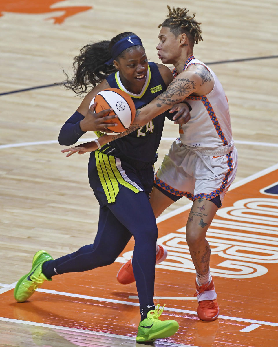 Connecticut Sun guard Natisha Hiedeman commits the foul on Dallas Wings guard Arike Ogunbowale during a WNBA basketball game Tuesday, June 22, 2021, at Mohegan Sun Arena in Uncasville, Conn. (Sean D. Elliot/The Day via AP)