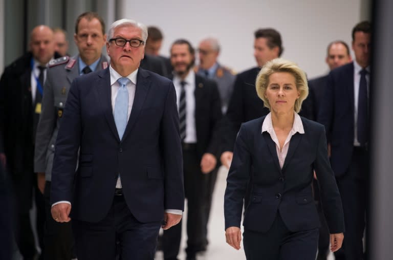 German Defence Minister Ursula von der Leyen (R) and German Foreign Minister Frank-Walter Steinmeier arrive for a press conference on November 26, 2015 at the lower house of German parliament (Bundestag) in Berlin