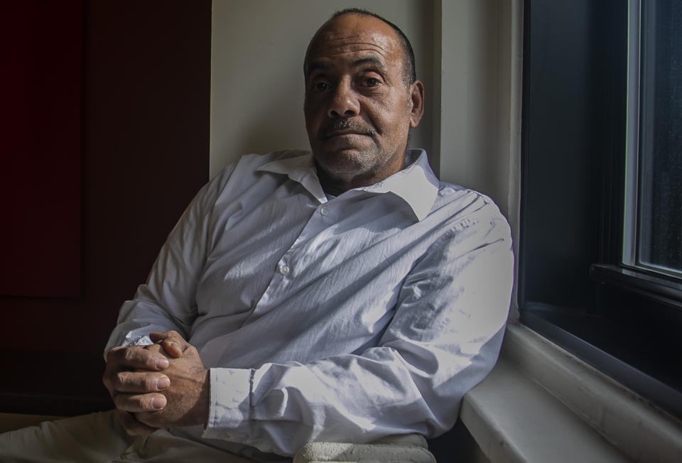 Rafael Ruiz, 60, sits in his lawyer's office at the Innocence Project, after his exoneration last Tuesday of a violent rape charge that sent him to prison for 25 years, Thursday Jan. 30, 2020, in New York. (AP Photo/Bebeto Matthews)