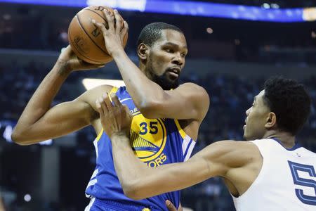 Apr 10, 2019; Memphis, TN, USA; Golden State Warriors forward Kevin Durant (35) controls the ball as Memphis Grizzlies forward Bruno Caboclo (5) defends in the second quarter at FedExForum. Mandatory Credit: Nelson Chenault-USA TODAY Sports