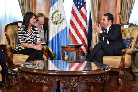 U.S. Ambassador to the United Nations Nikki Haley listens to Guatemalan President Jimmy Morales during a meeting at the National Palace in Guatemala City, Guatemala, February 28, 2018. Guatemalan Presidency/Handout via REUTERS