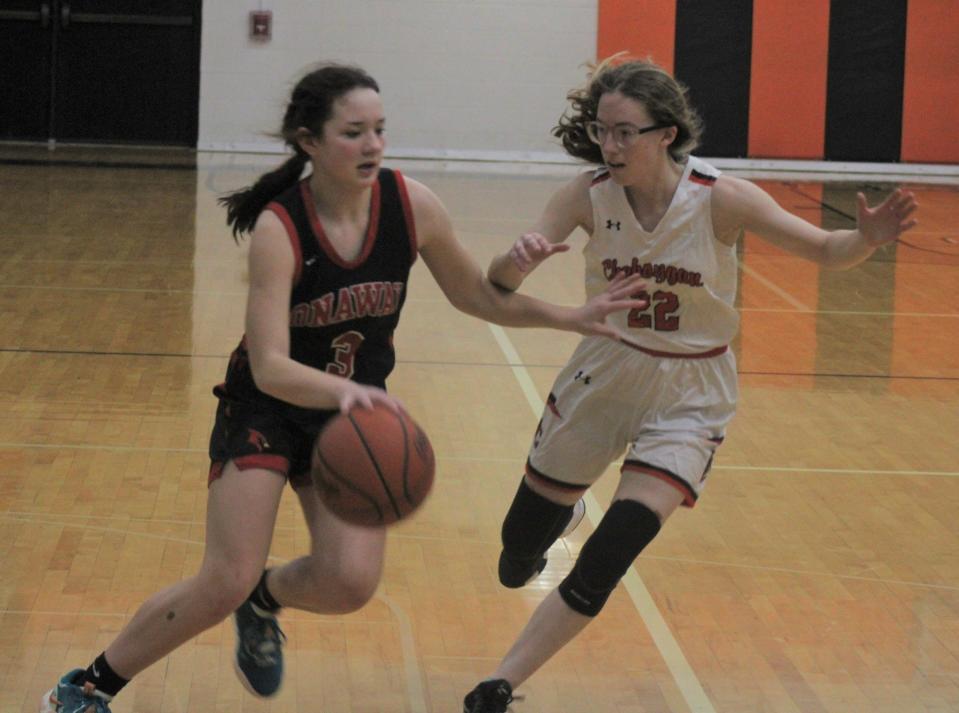 Sophomore guard Charlotte Box (left) scored 17 points and helped the Onaway girls basketball team claim a district semifinal win at Rogers City on Wednesday.