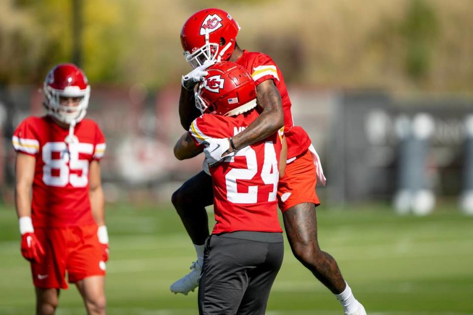 Kansas City Chiefs wide receiver Mecole Hardman (12) jumps on wide receiver Skyy Moore (24) during a team practice on Thursday, Oct. 19, 2023, in Kansas City. Nick Wagner/nwagner@kcstar.com