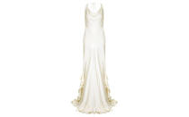 <p>The cowl neckline is one favoured among the fashion elite this season and will prove an elegant choice for the aisle. Ghost’s Willow gown also features a frilled train and silk shoestring tie, a definite choice for understated brides. <a rel="nofollow noopener" href="https://www.ghost.co.uk/willow-dress-chalk-white-dx24ca-c04" target="_blank" data-ylk="slk:Shop now" class="link "><em>Shop now</em></a>. </p>