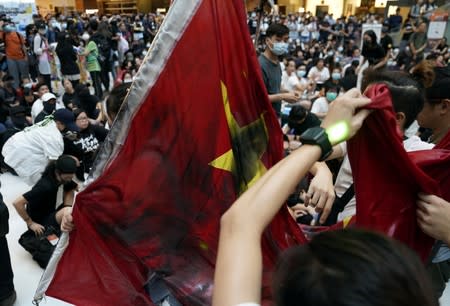 Anti-government protesters hold a rally in a shopping mall in Sha Tin, Hong Kong, China