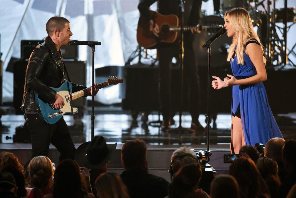 <p>Kelsea Ballerini can definitely light up a stage on her own, but <a href="https://www.youtube.com/watch?v=SkV5XqEd2Do" rel="nofollow noopener" target="_blank" data-ylk="slk:Nick Jonas showed up;elm:context_link;itc:0;sec:content-canvas" class="link ">Nick Jonas showed up</a> during her rendition of "Love Me Like You Mean It" and "Peter Pan" at the 2016 awards. Fans complained that the Jonas brother isn't a country singer and noted that his guitar playing was slightly stiff, but he might have just been nervous to be playing next to Kelsea. </p>