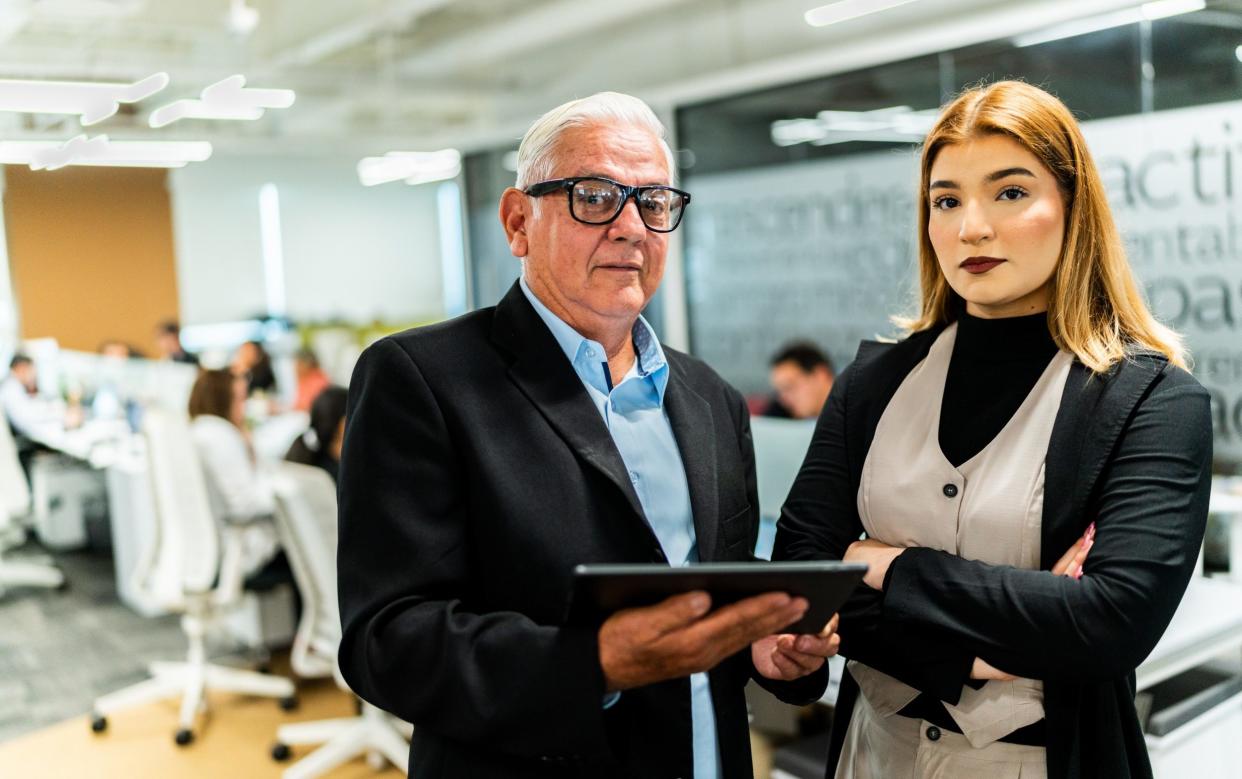 Old and young person in the office