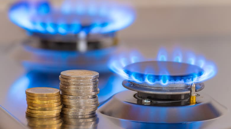 coins next to gas stove top