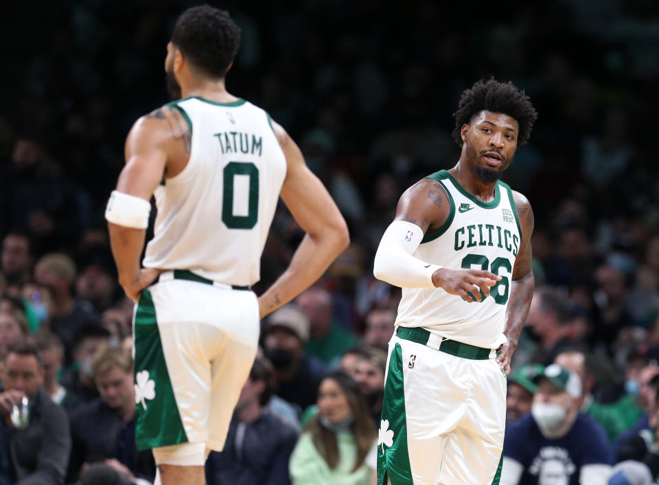 Boston - November 1:  The Celtics Marcus Smart is pictured as he talks to a referee at right, with Jayson Tatum at left. The Boston Celtics hosted the Chicago Bulls in a regular season NBA basketball game at the TD Garden in Boston on Nov. 1, 2021. (Photo by Jim Davis/The Boston Globe via Getty Images)