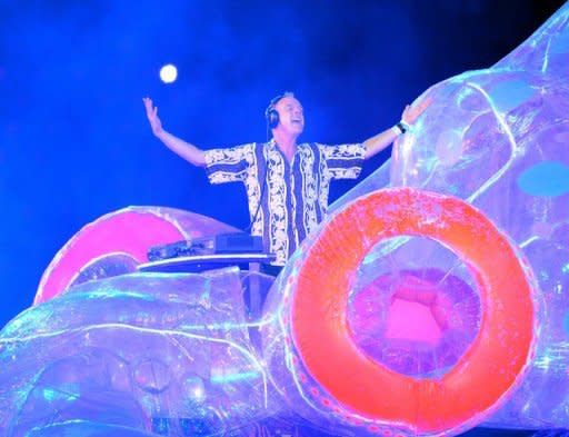 British DJ and musician Fatboy Slim performs during the closing ceremony of the 2012 London Olympic Games at the Olympic stadium in London on August 12, 2012