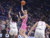 Iowa's Caitlin Clark (22) dishes off a pass against Penn State during the second half of an NCAA college basketball game, Sunday, Feb. 5, 2023, in State College, Pa. (AP Photo/Gary M. Baranec)