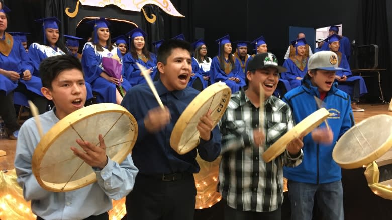 'One proud mom': Mother and son share graduation memories 18 years apart