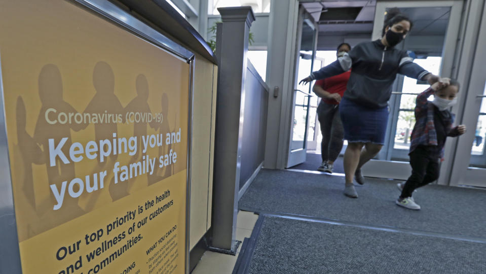 A sign on how to keep your family safe during the coronavirus pandemic rests near an entrance to SouthPark Mall, Wednesday, May 13, 2020, in Strongsville, Ohio. Ohio retail businesses reopened Tuesday following a nearly two-month-long shutdown ordered by Gov. Mike DeWine to limit the spread of the coronavirus. (AP Photo/Tony Dejak)