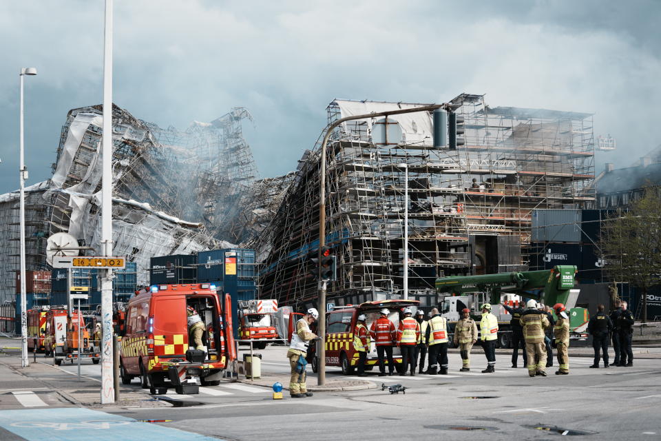 The outer wall of the Stock Exchange has collapsed towards Boersgade, Copenhagen, Thursday, April 18, 2024. A fire raged through one of Copenhagen’s oldest buildings on Tuesday, causing the collapse of the iconic spire of the 17th-century Old Stock Exchange as passersby rushed to help emergency services save priceless paintings and other valuables. (Thomas Traasdahl/Ritzau Scanpix via AP)