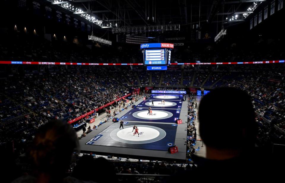 Fans cheer on the wrestlers at the the U.S. Olympic Team Trials at the Bryce Jordan Center on Friday, April 19, 2024.
