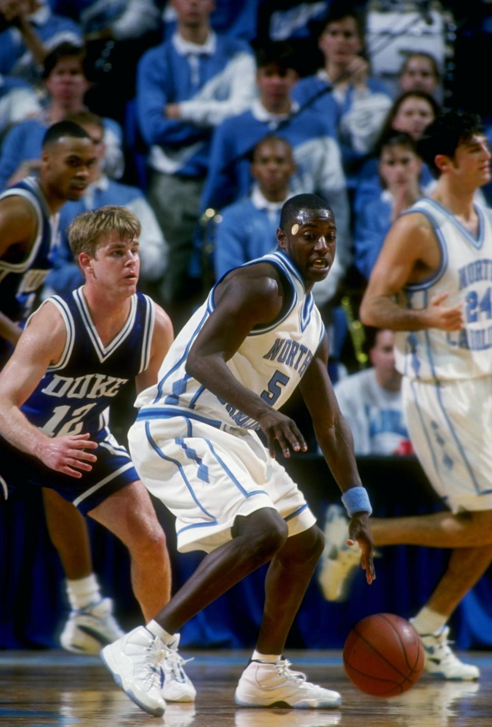 31 Jan 1996: Guard Jeff McInnis of the North Carolina Tar Heels tries to fend off guard Steve Wojciechowski of the Duke Blue Devils during a game at the Dean Smith Center in Chapel Hill, North Carolina. North Carolina won the game 73-72. Mandatory Credi