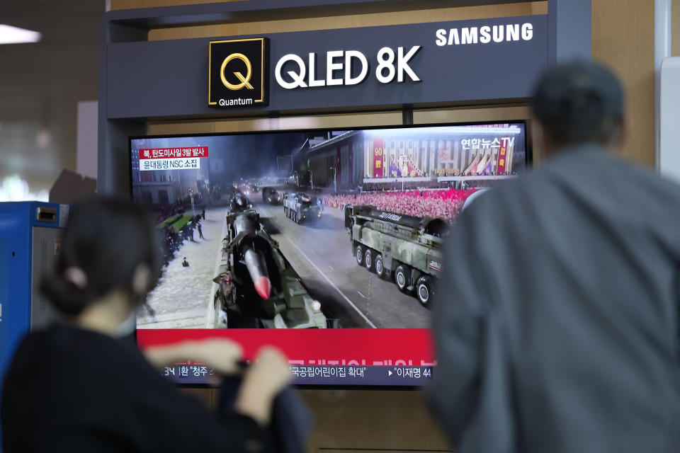 People watch a TV screen showing a news program reporting about North Korea's missile launch with file footage, at a train station in Seoul, South Korea, Wednesday, May 25, 2022. North Korea launched three ballistic missiles toward the sea on Wednesday, its neighbors said, hours after President Joe Biden wrapped up his trip to Asia where he reaffirmed U.S. commitment to defend its allies in the face of the North's growing nuclear threat. (AP Photo/Lee Jin-man)