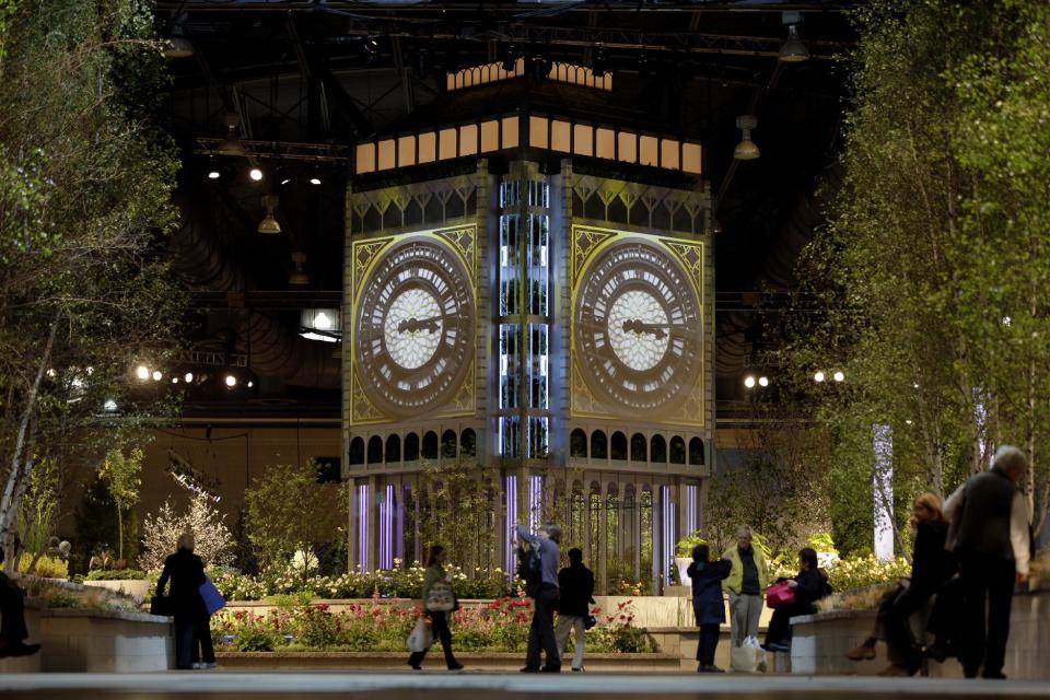 People attend a preview for the annual Philadelphia Flower Show featuring a replica of the Elizabeth Tower of the Houses of Parliament, at the Pennsylvania Convention Center in Friday, March 1, 2013, in Philadelphia. More than 270,000 people are expected to converge on the Pennsylvania Convention Center for the event, which runs through March 10. Billed as the world's largest indoor flower show, it's also one of the oldest, dating back to 1829. (AP Photo/Matt Rourke)