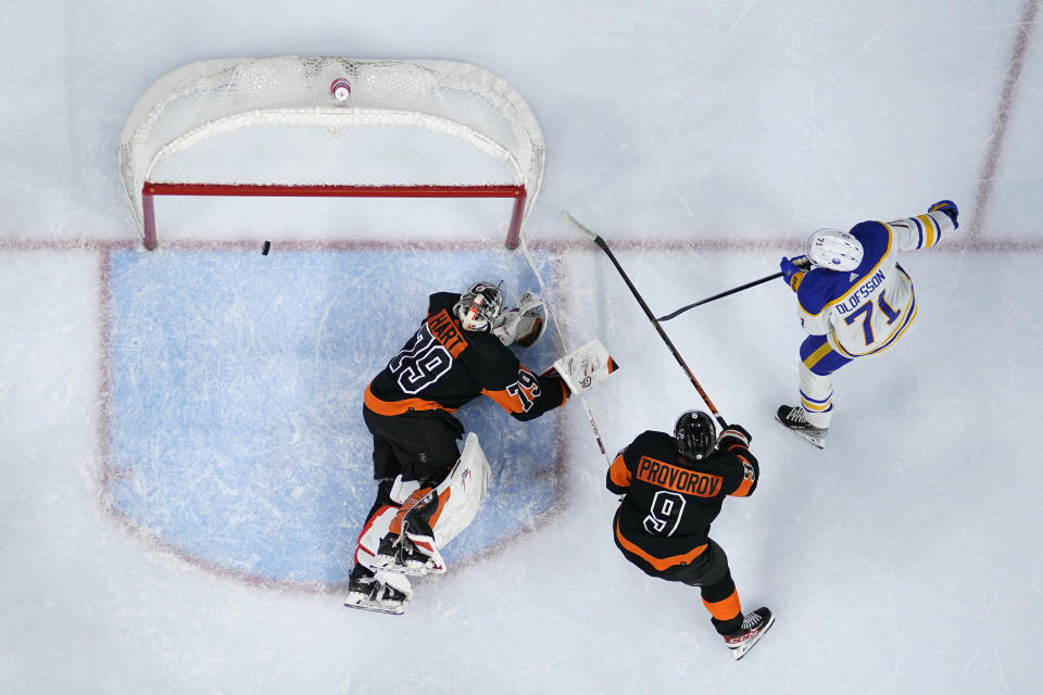 Buffalo Sabres' Victor Olofsson (71) scores a goal past Philadelphia Flyers' Carter Hart (79) and Ivan Provorov (9) during the third period of an NHL hockey game, Friday, March 17, 2023, in Philadelphia. (AP Photo/Matt Slocum)
