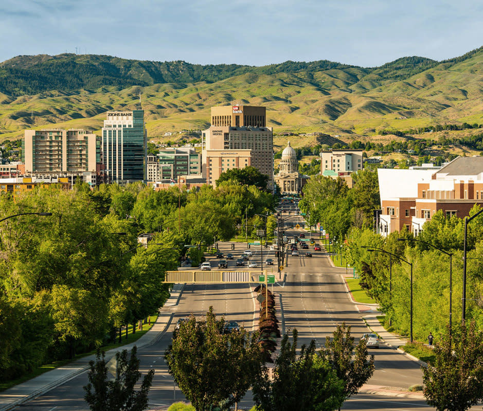 <p>Visit Boise</p><p>The secret’s out about <a href="https://www.yahoo.com/lifestyle/10-wildest-ways-experience-boise-204413765.html" data-ylk="slk:Boise;elm:context_link;itc:0;sec:content-canvas;outcm:mb_qualified_link;_E:mb_qualified_link;ct:story;" class="link  yahoo-link">Boise</a>, but thankfully Idaho’s capital city still has more than enough green space inside its borders to keep it from feeling overrun. A whitewater park in the city churns out waves for landlocked surfers and kayakers and more than 100 miles of hiking and biking trails thread Boise and its environs. A 25-mile <a href="https://www.cityofboise.org/departments/parks-and-recreation/parks/boise-greenbelt/" rel="nofollow noopener" target="_blank" data-ylk="slk:Boise River Greenbelt;elm:context_link;itc:0;sec:content-canvas" class="link ">Boise River Greenbelt</a> that shoots through the city makes getting outside and on a trail a breeze. The food scene is commendable, too. Boise chef Kris Komori won the James Beard Award for best chef in the mountain region last year. Get a reservation at his artistic prix fixe restaurant and cocktail bar, <a href="https://www.kinboise.com/" rel="nofollow noopener" target="_blank" data-ylk="slk:KIN;elm:context_link;itc:0;sec:content-canvas" class="link ">KIN</a>.</p><p><strong>When to Visit:</strong> Come to ski in the winter or check out Boise in moderate shoulder seasons between March and May and September and November.</p><p><strong>What to Do: </strong>Notch off a visit to the <a href="https://history.idaho.gov/oldpen/" rel="nofollow noopener" target="_blank" data-ylk="slk:Old Idaho Penitentiary;elm:context_link;itc:0;sec:content-canvas" class="link ">Old Idaho Penitentiary</a> (on the National Register of Historic Places) before amping the outdoor action. The classic move here is<a href="https://www.floattheboise.org/" rel="nofollow noopener" target="_blank" data-ylk="slk:floating the Boise River;elm:context_link;itc:0;sec:content-canvas" class="link "> floating the Boise River</a> between Barber Park and out at Ann Morrison Park. You'll need a sturdy tube, raft, or an SUP, which you can rent at Barber.</p><p><strong>Where to Stay:</strong> Cool kids are staying at <a href="https://themodernhotel.com/hotel-story/" rel="nofollow noopener" target="_blank" data-ylk="slk:The Modern Hotel;elm:context_link;itc:0;sec:content-canvas" class="link ">The Modern Hotel</a>, a revamped Travelodge that’s bursting with personality and has an on-site bar and restaurant decked with art from locals. Or get your vacation out of the group chat so you and your buddies can take over the five-room <a href="https://www.franklinhouseboise.com/" rel="nofollow noopener" target="_blank" data-ylk="slk:Franklin House Bed & Beer;elm:context_link;itc:0;sec:content-canvas" class="link ">Franklin House Bed & Beer</a>, which has a seasonal beer garden.</p><p><strong>Where to Eat: </strong>You bet you can get a bacon flight at <a href="https://baconboise.com/" rel="nofollow noopener" target="_blank" data-ylk="slk:Bacon Boise;elm:context_link;itc:0;sec:content-canvas" class="link ">Bacon Boise</a>, which offers five kinds of bacon with varied sweet, smoke, and spice. The cocktail menu at <a href="https://www.pressandpony.com/" rel="nofollow noopener" target="_blank" data-ylk="slk:Press & Pony;elm:context_link;itc:0;sec:content-canvas" class="link ">Press & Pony</a> has the classics covered, as well as some creative riffs like an Idaho Fashioned with sugar beet syrup. Get a solid introduction to Idaho beers at <a href="https://bittercreekalehouse.com/" rel="nofollow noopener" target="_blank" data-ylk="slk:Bittercreek Alehouse;elm:context_link;itc:0;sec:content-canvas" class="link ">Bittercreek Alehouse</a>.</p>